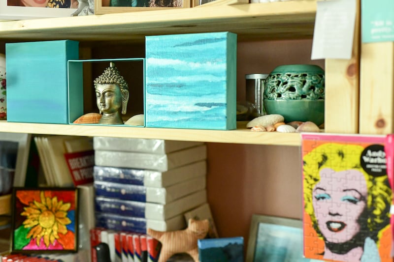 Souvenirs from Ms Lakshmi's travels on shelves in one of her bedrooms, which has been converted into an art studio.