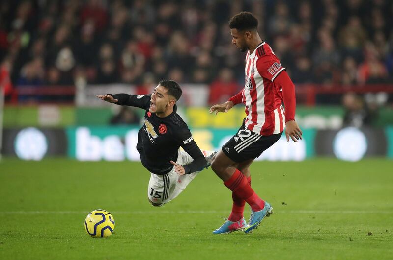 Manchester United's Andreas Pereira is challenged by Lys Mousset of Sheffield United. Reuters