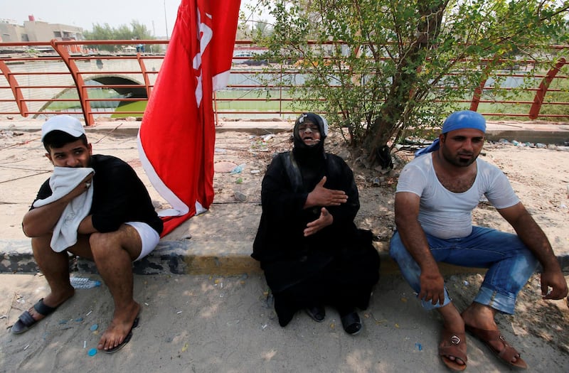 Mourners react during the funeral. Reuters