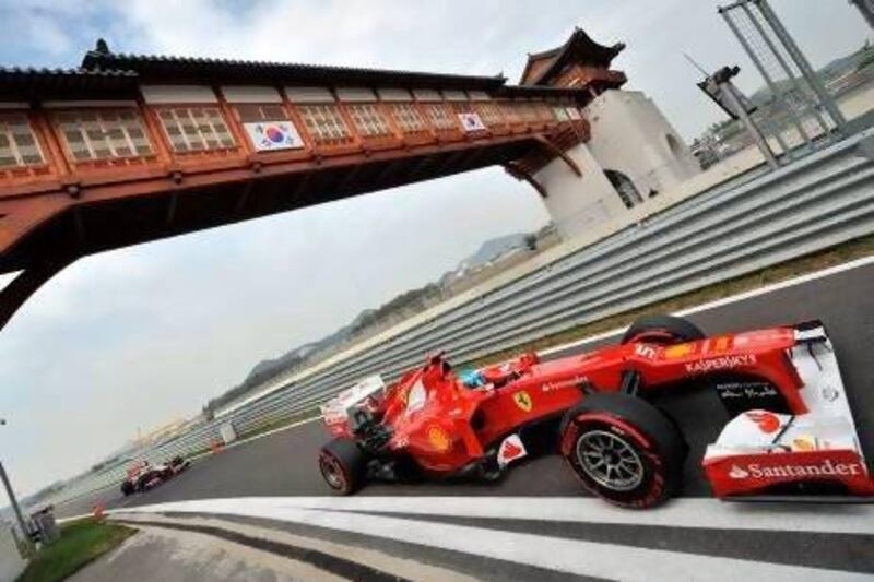 Ferrari driver Fernando Alonso enters the pit lane.