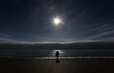 A man sits on the Promenade des Anglais in Nice amid the coronavirus disease (COVID-19) outbreak in France, February 16, 2021.   REUTERS/Eric Gaillard     TPX IMAGES OF THE DAY