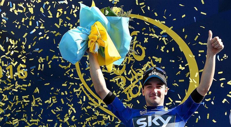 Italian rider Elia Viviani of Team Sky wears the overall leader's blue jersey as he celebrates on the podium after winning the second stage of the 2016 Dubai Tour on Thursday. Daniel Dal Zennaro / EPA / February 4, 2016  