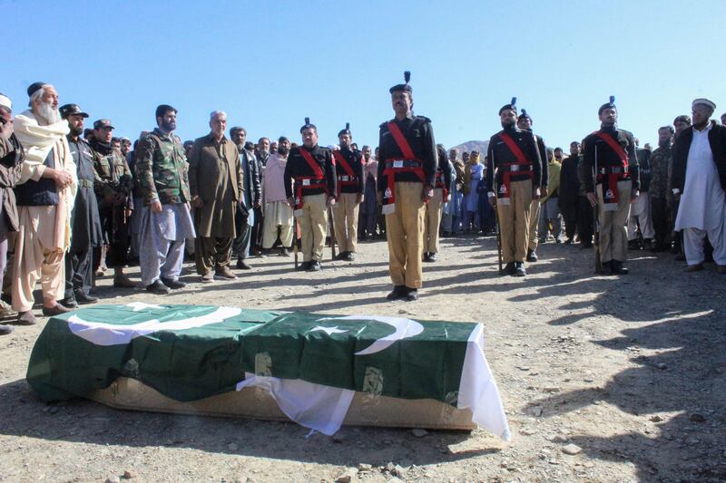 Security officials and relatives attend a funeral ceremony of a slain policeman who was killed in an attack claimed by the TTP in the border town of Chaman. AFP