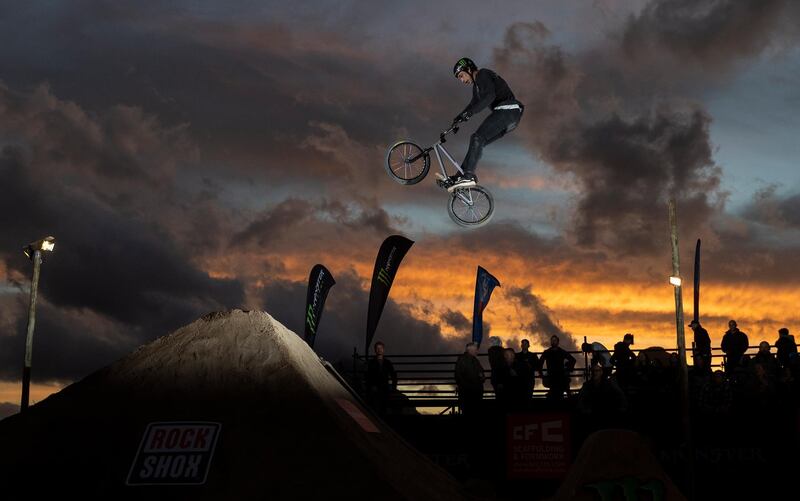 A rider competes in the Night Harvest BMX and mountain bike event in Cape Town, South Africa. The Night Harvest now in its eighth year is the largest and most unique BMX and mountain bike dirt jump competition in Africa.  EPA