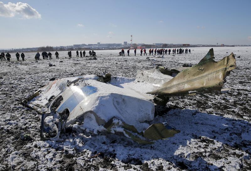 FILE PHOTO: Emergencies Ministry members work at the crash site of a Boeing 737-800 Flight FZ981 operated by Dubai-based budget carrier Flydubai, at the airport of Rostov-On-Don, Russia, March 20, 2016. REUTERS/Maxim Shemetov/File Photo