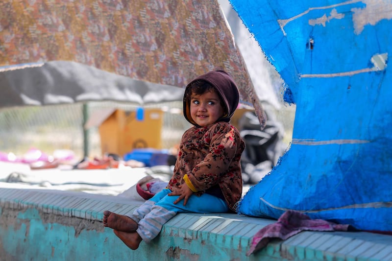 An Afghan child at a temporary shelter at a park in Kabul, Afghanistan. EPA