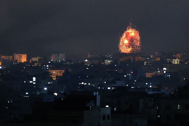 An explosion lights up the sky during an Israeli air strike on Beit Lahia in northern Gaza on Friday. AFP / Mohammed Abed
