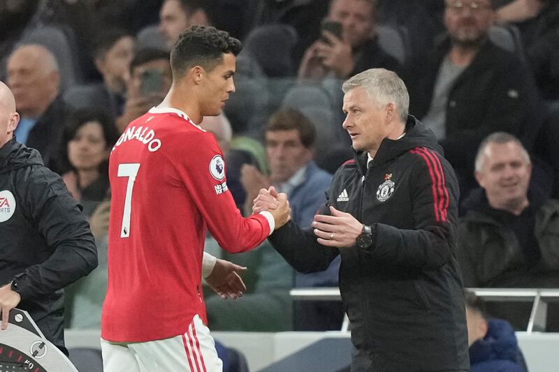Manchester United's Cristiano Ronaldo, left, greets manager Ole Gunnar Solskjaer. AP Photo
