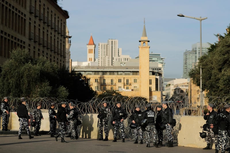 Police stand guard on the road leading to the parliament building in downtown Beirut. AP