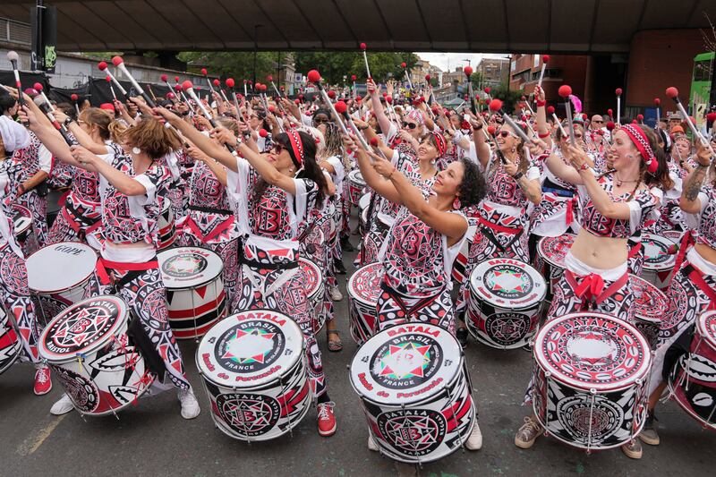 Dancing and drumming on the streets of west London at the Notting Hill Carnival. Reuters