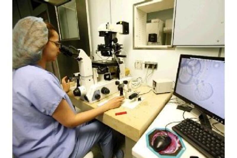 A specialist at Amman's Farah Hospital working in the in vitro fertilisation lab.