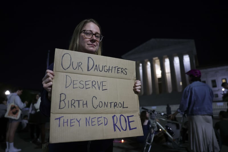 A demonstrator outside the court.  AFP