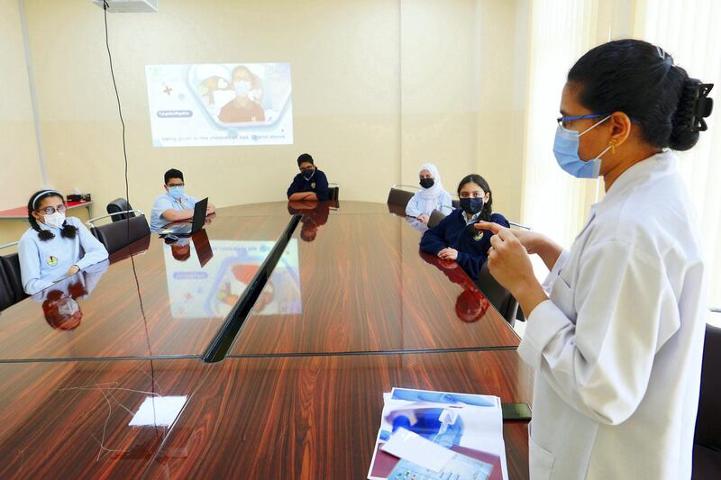 Blessy Jinu, staff nurse explaining about the Covid 19 vaccine to the students at the Al Shola American School in Ajman on June 8 , 2021. Pawan Singh / The National. Story by Salam