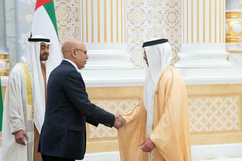 ABU DHABI, UNITED ARAB EMIRATES - February 02, 2020: HE Mohamed Ould Ghazouani, President of Mauritania (2nd L) greets HH Sheikh Hamed bin Zayed Al Nahyan, members of Abu Dhabi Executive Council (R), during an official visit reception, at Qasr Al Watan. Seen with HH Sheikh Mohamed bin Zayed Al Nahyan, Crown Prince of Abu Dhabi and Deputy Supreme Commander of the UAE Armed Forces (L).

( Hamad Al Kaabi / Ministry of Presidential Affairs )​
---