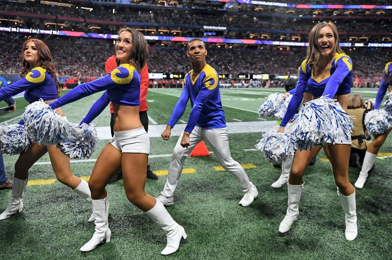 Rams cheerleader Napoleon Jinnies (C) performs with other cheerleaders during Super Bowl LIII between the New England Patriots and the Los Angeles Rams at Mercedes-Benz Stadium in Atlanta, Georgia, on February 3, 2019. (Photo by TIMOTHY A. CLARY / AFP)