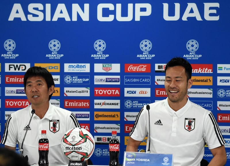 Japan's player Maya Yoshida, right, with head coach Hajime Moriyasu, left, attend the pre-match press conference ahead of the AFC Asian Cup final match against Qatar at the Zayed Sports City Stadium in Abu Dhabi.  AFP