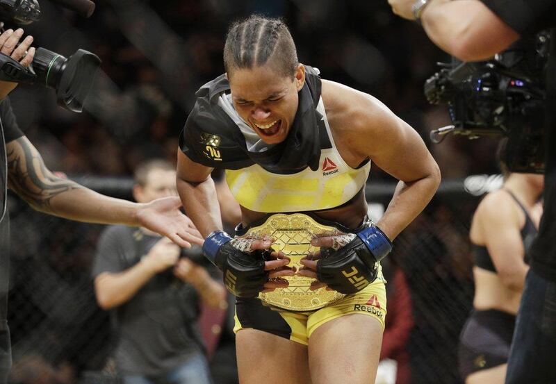 Amanda Nunes celebrates after defeating Miesha Tate during their women's bantamweight championship mixed martial arts bout at UFC 200, Saturday, July 9, 2016, in Las Vegas. John Locher / AP Photo