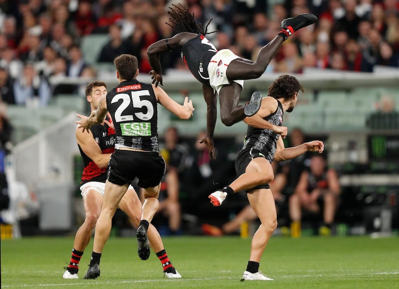 Anthony McDonald-Tipungwuti and Josh Daicos compete for the ball during the AFL match between the Collingwood Magpies and the Essendon Bombers at the Melbourne Cricket Ground. Getty