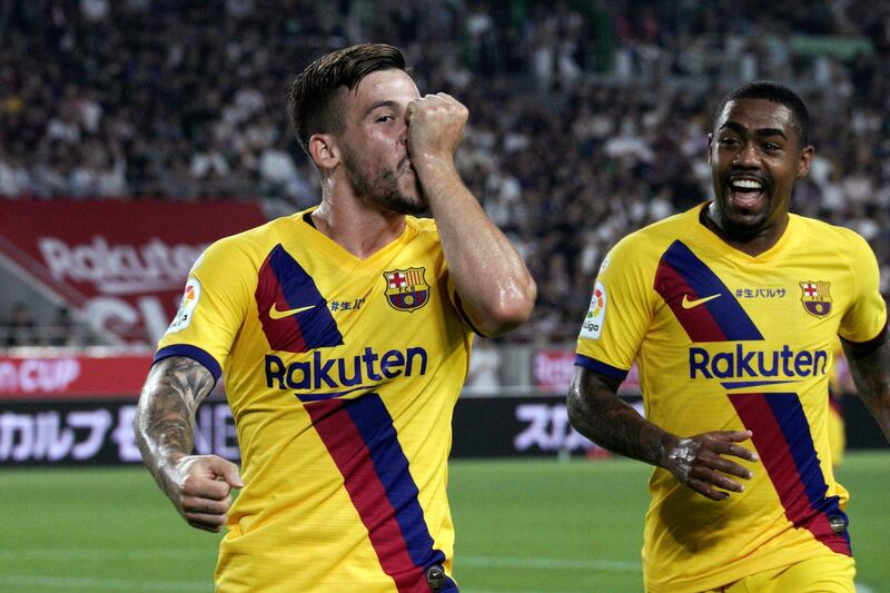 Barcelona's Carles Perez, left, celebrates his opening goal against Vissel Kobe. AP Photo