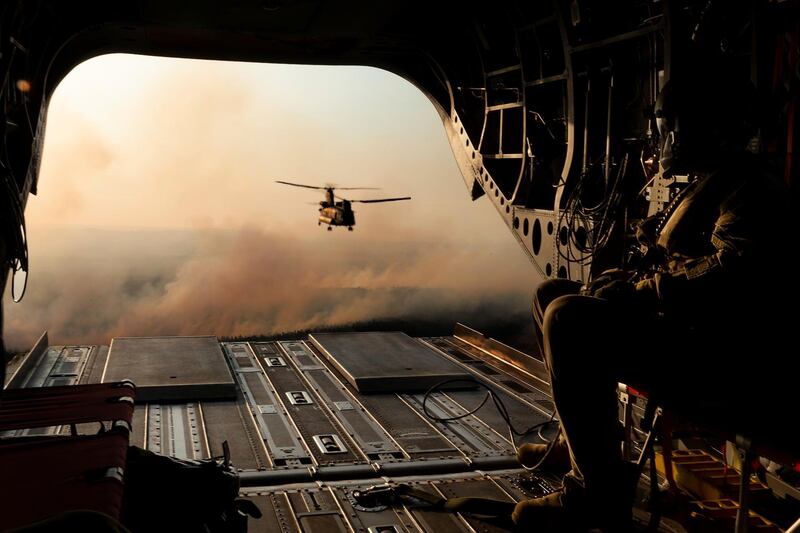 Australian Army CH-47 Chinooks from the 5th Aviation Regiment return from delivering hay bales to remote bushfire-affected farms on Kangaroo Island, Australia.  Reuters