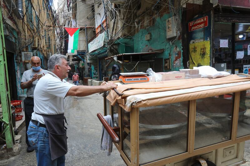 A street sweets vendor waits for customers in Shatila refugee camp. AFP