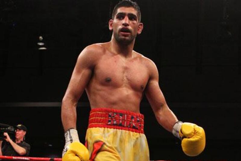 Amir Khan was bemused by the length of time between the time his fight with Lamont Peterson ended and the final result was announced. His management team says a rematch is in the works.