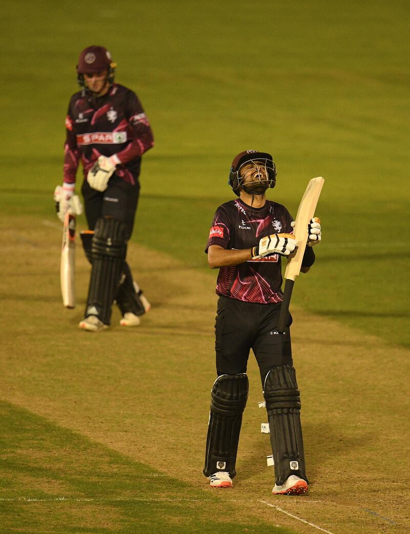 Babar Azam of Somerset celebrates after reaching his century at Sophia Gardens. Getty