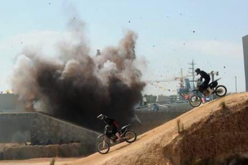 Motorcyclists take part in the Idex opening ceremony. Reuters