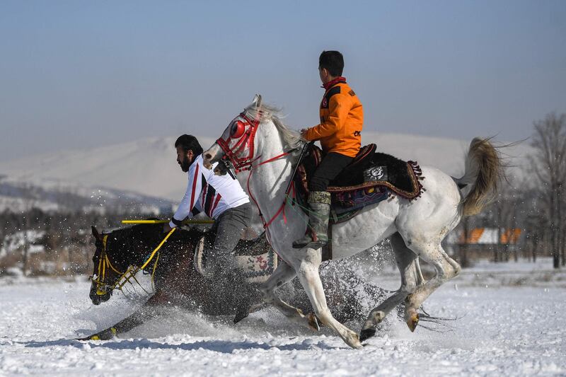 A competitor's horse stumbles during a jereed game, in Erzurum, Turkey. A match lasts for two 45-minute periods. AFP