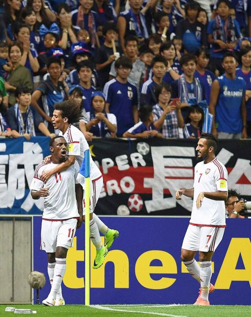 Ahmed Khalil, left, celebrates his and the UAE's second goal in a 2-1 win over Japan at Saitama Stadium 2002 in a 2018 World Cup qualifier on September 1, 2016. Atsushi Tomura / Getty Images