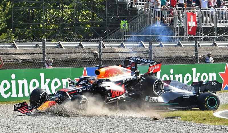 Red Bull's Max Verstappen and Mercedes' Lewis Hamilton crash out of the race. Reuters