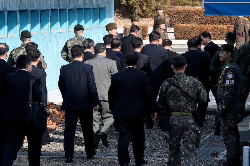 North Korea's chief delegate Ri Son Gwon (C, back) and delegates leave after meeting with South Korean delegates (not pictured) in the truce village of Panmunjom, North Korea, on January 9, 2018. Jung Ui-chel / EPA