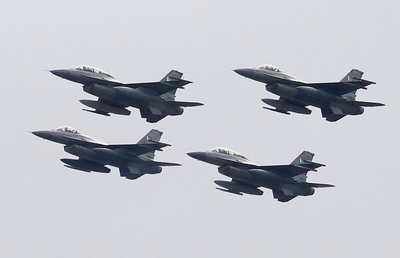 Pakistani Air Force F-16 fighter jets fly in formation during a military parade to mark Pakistan National Day, in Islamabad, Pakistan, Saturday, March 23, 2019. Pakistanis are celebrating their National Day with a military parade that's showcasing short- and long-range missiles, tanks, jets, drones and other hardware. (AP Photo/Anjum Naveed)