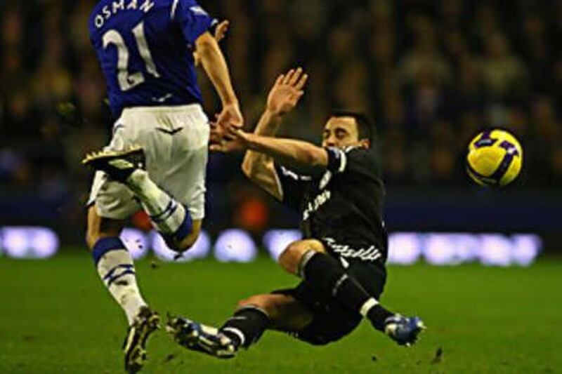 John Terry sends Leon Osman flying with a high tackle that earned the Chelsea captain a red card.