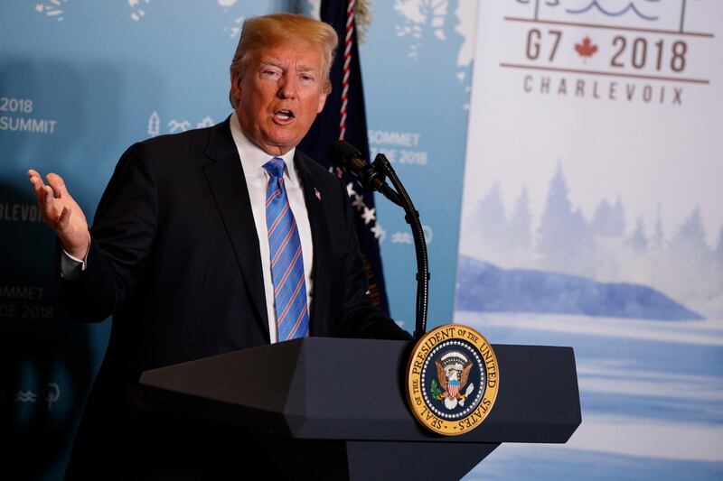 FILE - In this June 9, 2018 file photo, President Donald Trump speaks during a news conference at the G-7 summit in La Malbaie, Quebec, Canada.  New York Attorney General sues the Trump Foundation, Thursday, June 14, saying it engaged in a pattern of illegal self-dealing. (AP Photo/Evan Vucci, File)
