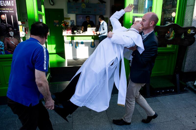 Members of the staff move a wax figure of Pope Francis outside The National Wax Museum in Dublin, Ireland. Pope Francis is due to visit Ireland on a two day visit. EPA