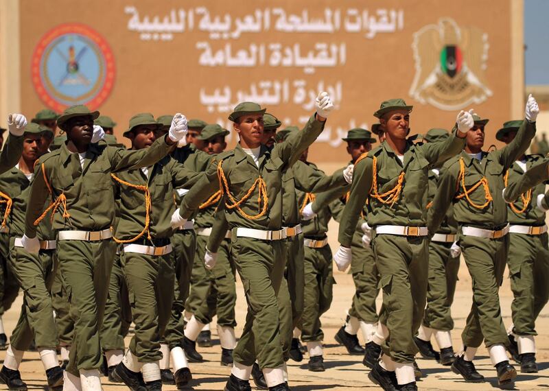 Fighters from the self-proclaimed Libyan National Army loyal to Khalifa Haftar attend their graduation ceremony at a military academy in Libya's eastern city of Benghazi on April 18, 2019.  / AFP / Abdullah DOMA
