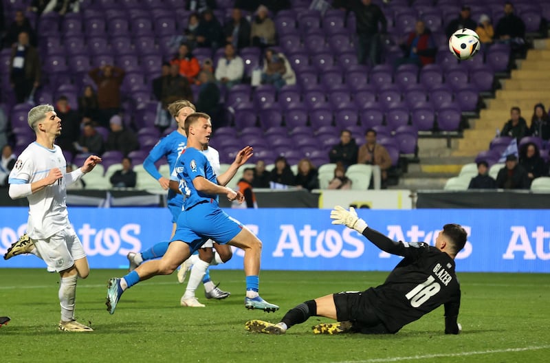 Albert Gudmundsson lifts the ball over the goalkeeper to score Iceland's third goal. Reuters