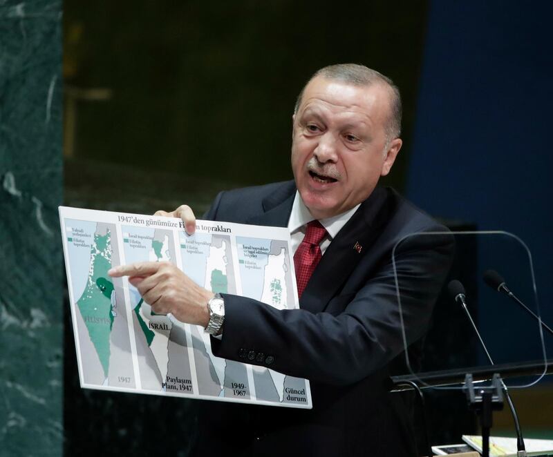 Turkish President Recep Tayyip Erdogan, holds a map showing the evolution of Israel and Palestinian state from 1947 as he addresses the general debate of the 74th session of the General Assembly of the United Nation . EPA