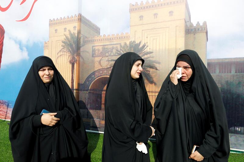 Mourners react as they attend the funeral of the Iranian Major-General Qassem Soleimani, head of the elite Quds Force of the Revolutionary Guards, and the Iraqi militia commander Abu Mahdi al-Muhandis, who were killed in an air strike at Baghdad airport, in Baghdad. REUTERS