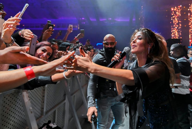Lebanese pop star Nancy Ajram greets fans at the Gamers8 concert series in Riyadh, where she teamed up with US DJ and producer Marshmello. AFP