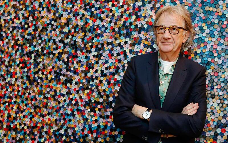 Fashion designer Paul Smith poses after an interview with Reuters at the media launch of the exhibition "Hello, My Name is Paul Smith", at the Design Museum in London November 14, 2013. When British fashion designer Paul Smith started his career more than 40 years ago in a tiny shop in Nottingham, little did he know he would build a global fashion empire worth millions on his ability to find inspiration from his surroundings   REUTERS/Luke MacGregor (BRITAIN - Tags: ENTERTAINMENT FASHION BUSINESS SOCIETY)