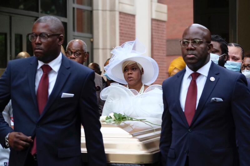 Tomika Miller walks out of the church, behind the casket of her husband, Rayshard Brooks, following a public viewing at Ebenezer Baptist Church in Atlanta. AP