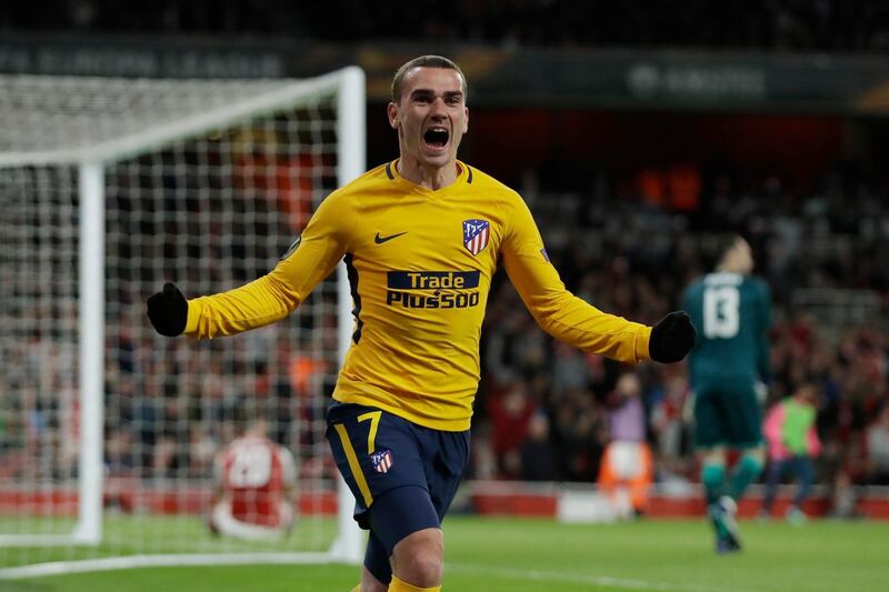 FILE - In this Thursday, April 26, 2018 file photo Atletico's Antoine Griezmann celebrates after scoring the first goal of his team during the Europa League semifinal first leg soccer match between Arsenal FC and Atletico Madrid at Emirates Stadium in London. (AP Photo/Matt Dunham, File)
