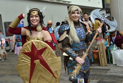 From left, cosplayers Kelsey Hinesley as Wonder Woman and Janelle Hinesley as Astrid. AFP