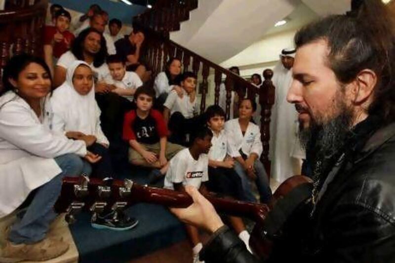 Ron ‘Bumblefoot’ Thal was kindness itself with the children and smiled as one of them played with his long beard, which was wrapped tightly in chains.