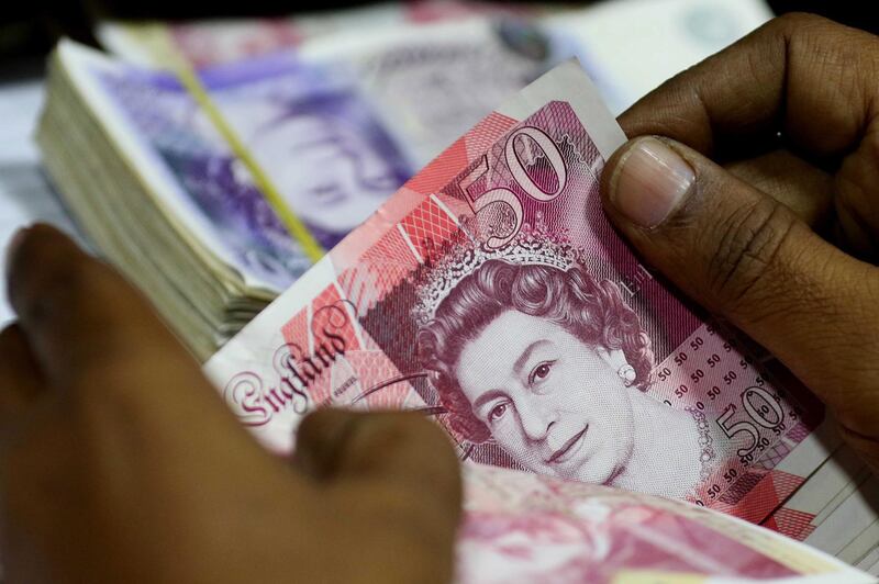 epa07223873 A currency exchange dealer shows British Pounds, in Karachi, Pakistan, 11 December 2018. The British pound dropped to a 20-month low against the dollar over Brexit situation.  EPA/SHAHZAIB AKBER