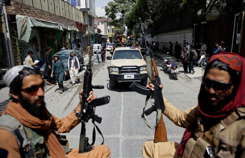 Taliban fighters patrol Kabul. AP