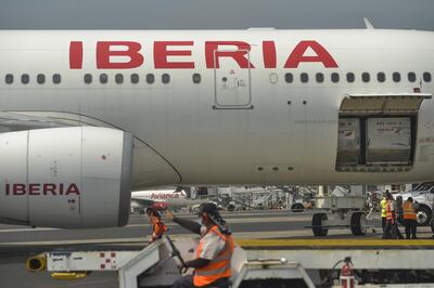 An Airbus SE A330-200 aircraft operated by Iberia, a unit of International Consolidated Airlines Group SA (IAG), carries AstraZeneca Plc Covid-19 vaccine doses at El Salvador International Airport (SAL) in San Luis Talpa, El Salvador, on Wednesday, Feb. 17, 2021. The shipment of AstraZeneca Plc vaccines arrived from India as El Salvador reports over 58,023 infections and 1,758 deaths. Photographer: Camilo Freedman/Bloomberg
