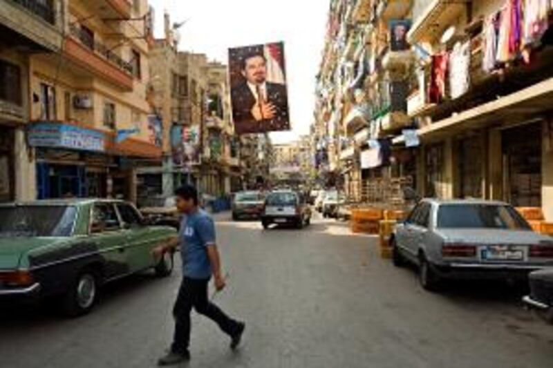 Election signs, including posters of Saad Hariri, dominated neighborhoods in the northern Lebanese city of Tripoli in May 2009. Mr Hariri is now addressing the possible derailment of his efforts towards a national unity government.
